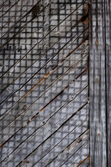 Fototapeta premium facade of an old wooden house on which an interesting pattern of plaster in the fixtures is formed
