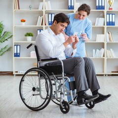 Disabled patient on wheelchair visiting doctor for regular check