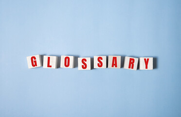 Glossary word made of square letter word on blue background.
