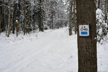 Bicycle tourist track during the winter.  Sign.                             