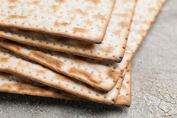 Jewish flatbread matza for Passover on table, closeup