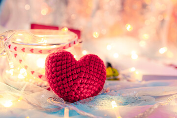 heart shape, Foam beads, feather and light decorative bokeh on blue cloth. Love, Valentine and holiday concept.