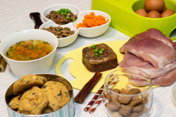 Preparing natural organic food for pets at home. Raw ingredients for pet food in bowl