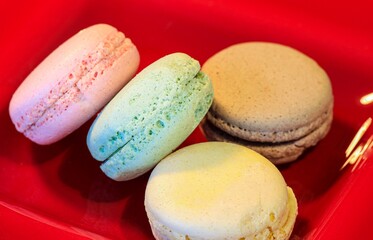 Macarons in different colours on a background