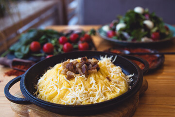 banosh, a traditional Ukrainian corn grain dish with fat and sheep cheese.