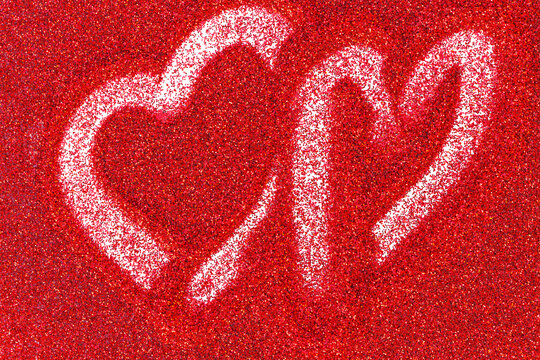 Red glitter background with a heart drawn a finger. Valentines day background - Powered by Adobe