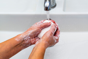 Fototapeta premium Washing hands with soap for coronavirus prevention, hygiene to stop spreading coronavirus.
