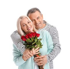 Mature couple with flowers on white background. Valentine's Day celebration