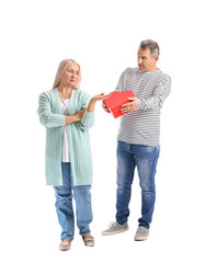 Mature man greeting his displeased wife on Valentine's Day against white background