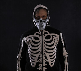 man in halloween skeleton clothing, man in hood