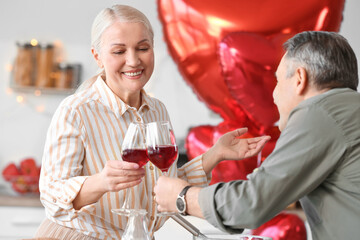 Mature couple celebrating Valentine's Day at home