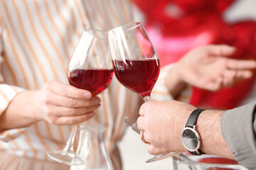 Mature couple celebrating Valentine's Day at home, closeup