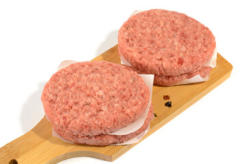 Raw beef patties for making a burger.Isolated on a white background.Selective Focus.