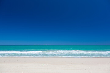 Fototapeta na wymiar Tropical beach, sea and blue sky.