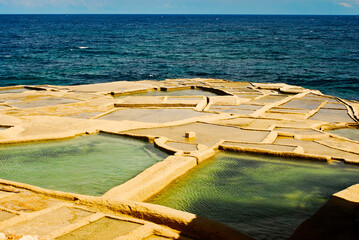 Salinas de Qolla I Bajda are ruins of historical salt pans near Marsalforn Gozo Maltese islands