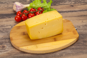 Hard yellow tasty cheese brick