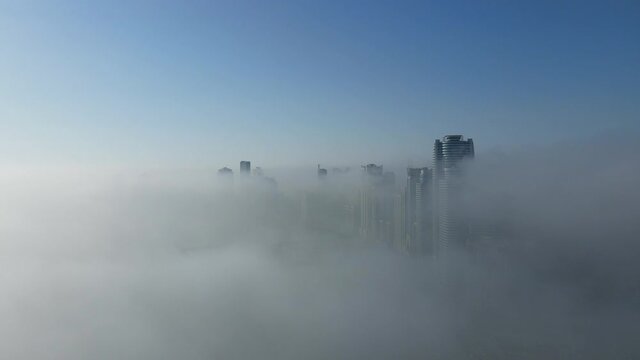 Drone view of Fog over Sharjah, Sharjah Khalid Lake covered in the winter morning fog, United Arab Emirates, 4K Drone Footage