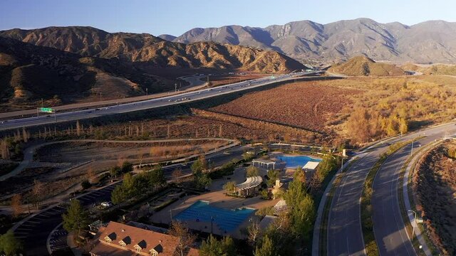Aerial descending shot of a community pool in a master-planned community in the desert. HD at 60 FPS.
