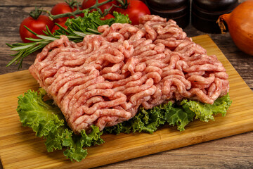 Raw pork minced meat over board