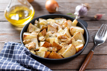 Baked potatoes with cheese in a pan. Selective focus