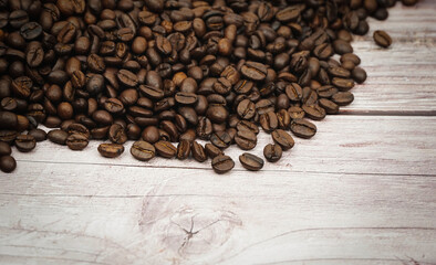 Coffee beans on wood background