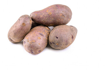Fototapeta na wymiar Raw pink potato tubers on a white isolated background.Potatoes in the skin.