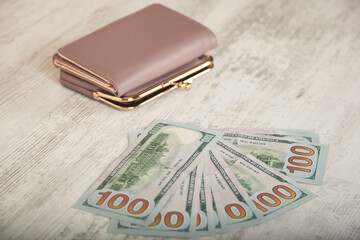 wallet with money  on desk