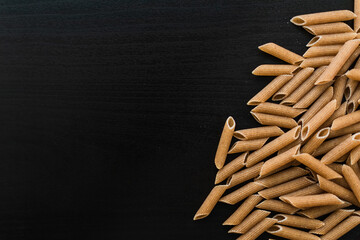 Wheat pasta on a black background