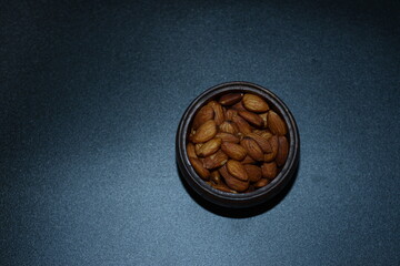 roasted almonds on black background