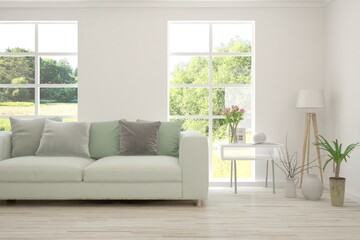 White living room with sofa and summer landscape in window. Scandinavian interior design. 3D illustration