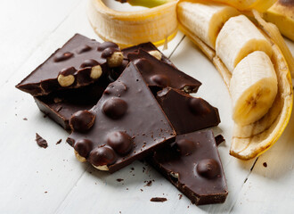 broken dark chocolate with hazelnuts and banana