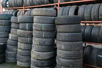 Used tire stacks in Workshop vulcanization yard in the city