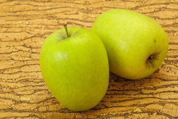 Two ripe green sweet apples