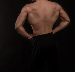 a guy with an athletic figure, with a naked torso unrecognizable