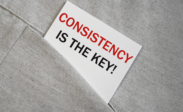 Business concept image.Consistency is The Key text on a sticker in a pocket.