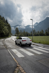 car on the road with mountains