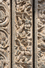 Lakkundi, Karnataka, India - November 6, 2013: Kasivisvesvara Temple. Detail of beige stone detailed sculptures on multi-frame around entrance.