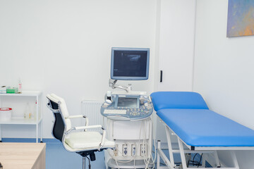 Medical modern ultrasound machine in an empty hospital diagnostic room