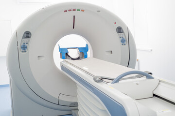 Modern CT scanner in a large hospital room