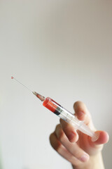 Syringe with a vaccine. Novel coronavirus disease 2019, COVID-19. Infectious pandemic. 