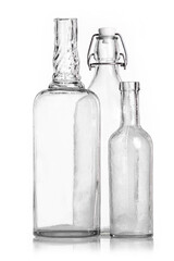 Transparent old antique bottles on a white background studio shot