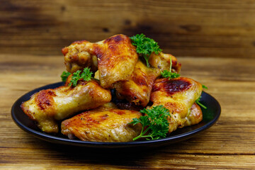 Baked chicken wings on a wooden table