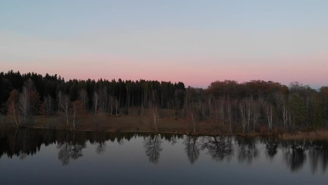 Staffelsee lake in Germany Bavaria recorded in the afternoon twilight flying over the lake with a DJI drone in 4k with ND filters.
Drone approaching shore