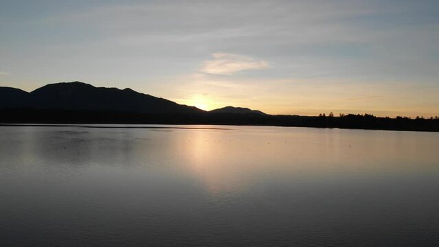 Staffelsee lake in Germany Bavaria recorded in the afternoon twilight flying over the lake with a DJI drone in 4k with ND filters
