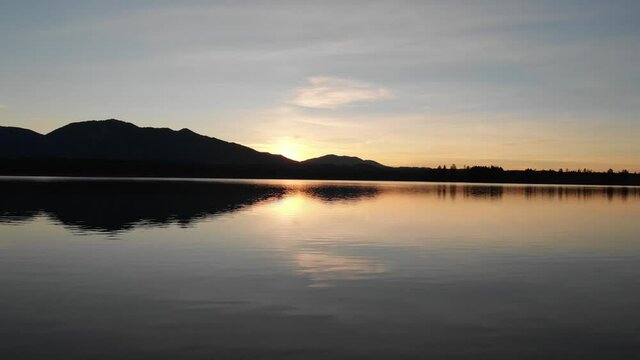 Staffelsee lake in Germany Bavaria recorded in the afternoon twilight flying over the lake with a DJI drone in 4k with ND filters