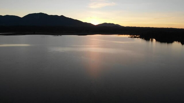 Staffelsee lake in Germany Bavaria recorded in the afternoon twilight flying over the lake with a DJI drone in 4k with ND filters