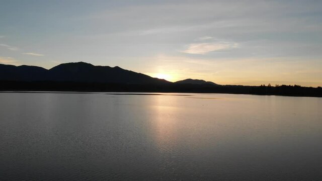 Staffelsee lake in Germany Bavaria recorded in the afternoon twilight flying over the lake with a DJI drone in 4k with ND filters