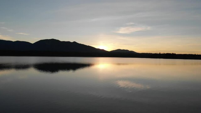 Staffelsee lake in Germany Bavaria recorded in the afternoon twilight flying over the lake with a DJI drone in 4k with ND filters