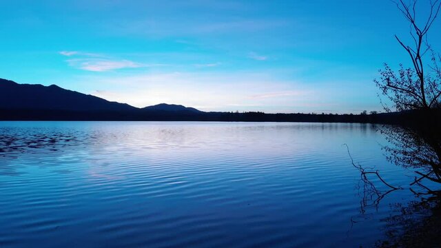 Staffelsee lake in Germany Bavaria recorded in the afternoon twilight flying over the lake with a DJI drone in 4k with ND filters