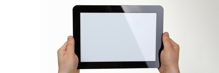 Close up of male hands showing modern tablet isolated on white background. Copy space on screen. Technology concept